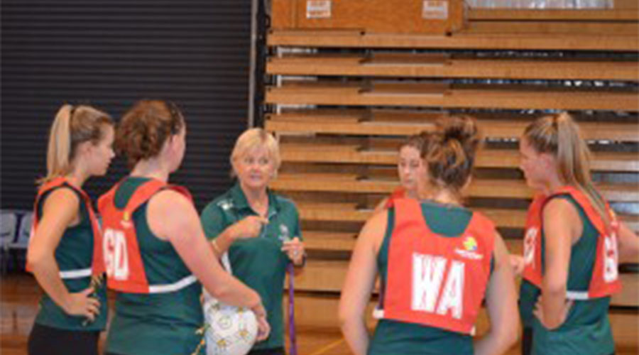 Tasmanian team being coached in training